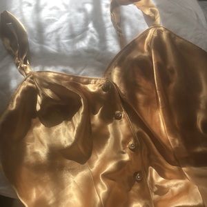gold satin romper dress with dimond buttons